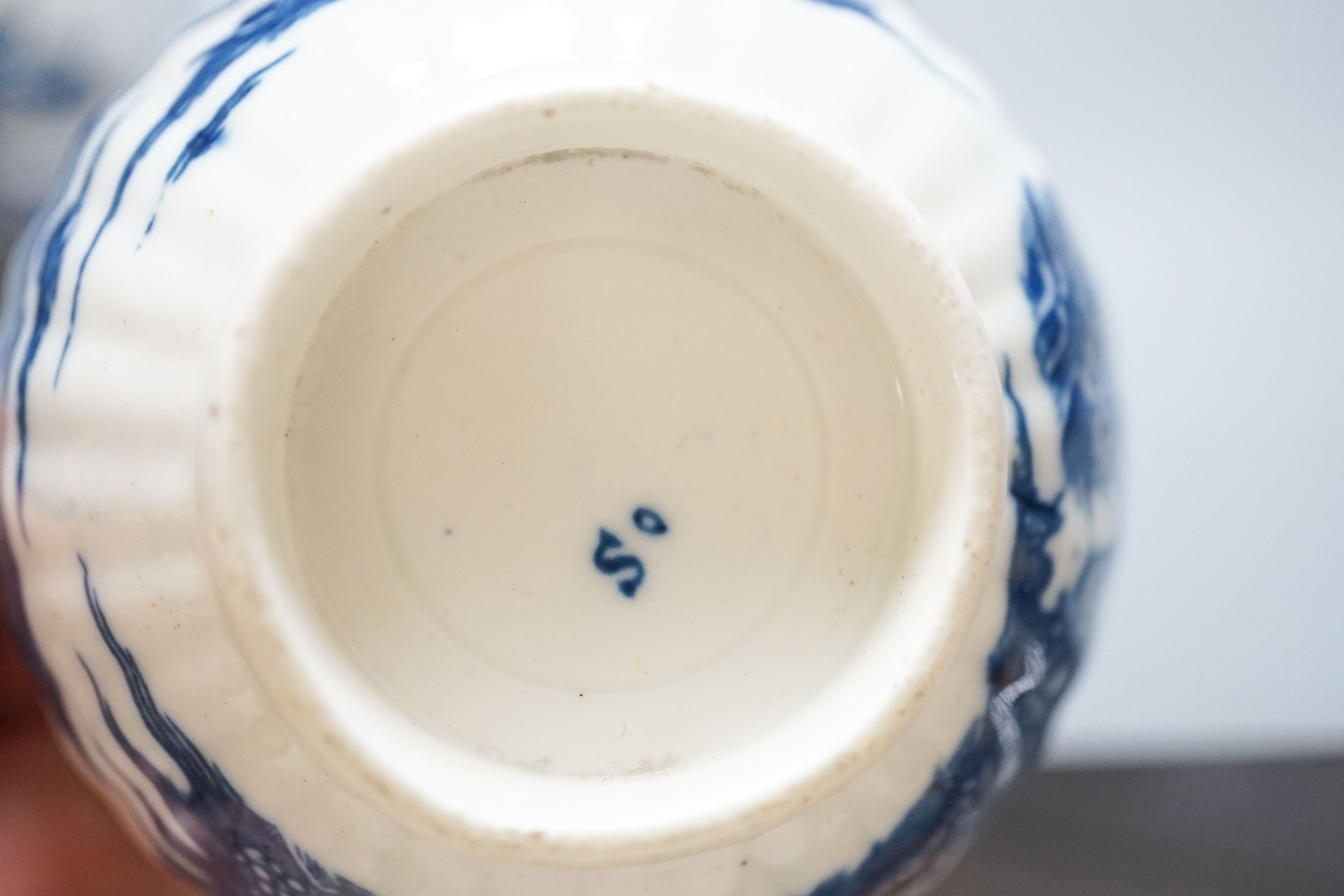 A group of Worcester and Caughley blue and white tea and coffee wares, late 18th century including fisherman pattern, three flowers pattern, chinoiserie figures etc.